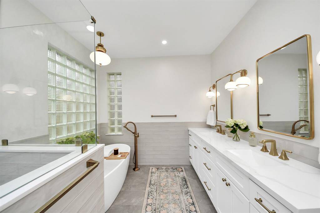 You didn’t think you needed this much space, but we promise that double vanities save marriages.