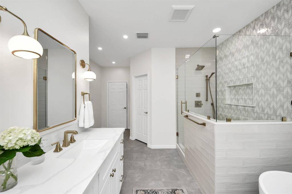 What you don’t see are the his and hers walk-in closets with custom Elfa designed storage shelves, drawers and hanging elements. And also the water closet with a custom built linen closet.