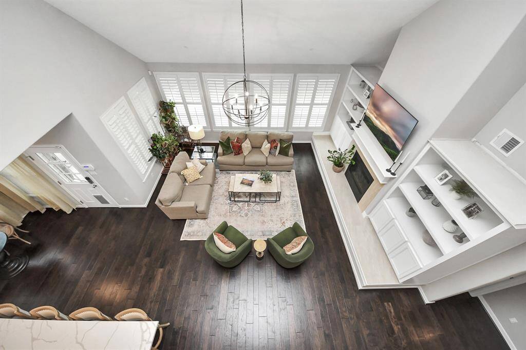 Over the other side, the high ceilings allow the opening up to the living room space as well. Not necessarily super functional until you need to drop something down stairs for somebody to catch.