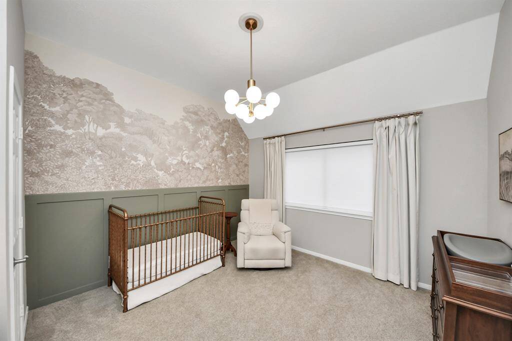 Finally the last bedroom is the only room without tall windows and plantation shudders. But with a newly installed pull down shade and black out curtains, the south side light can stay away.