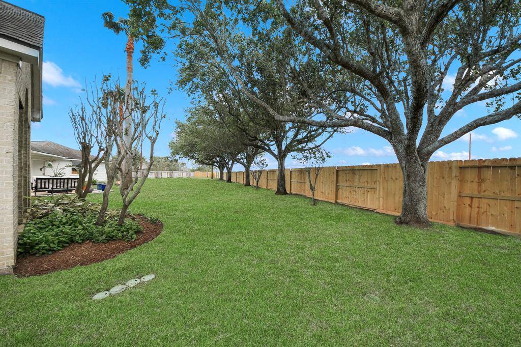 The fence surrounding most of the yard was replaced after the former fence line took the brunt of Hurricane Beryl.