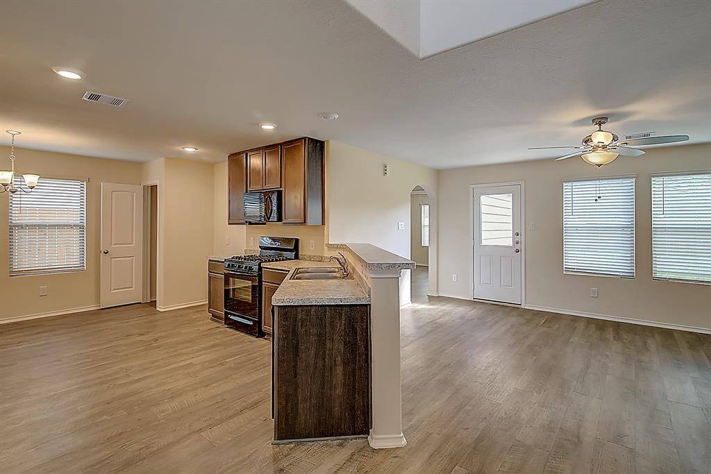 a view of the kitchen and living room
