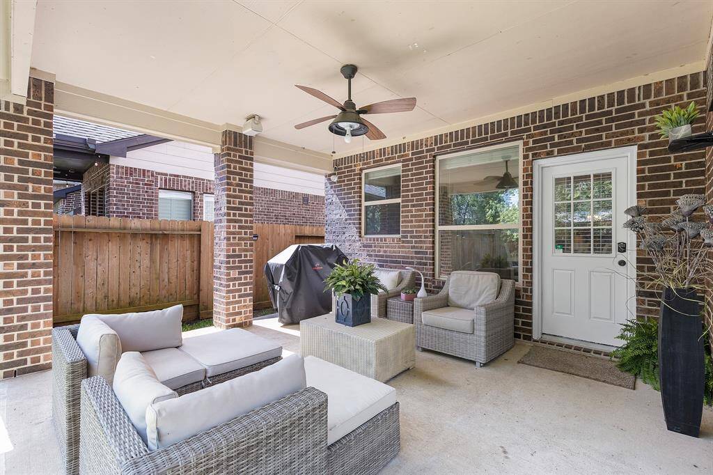 Charming Covered Patio with Fan