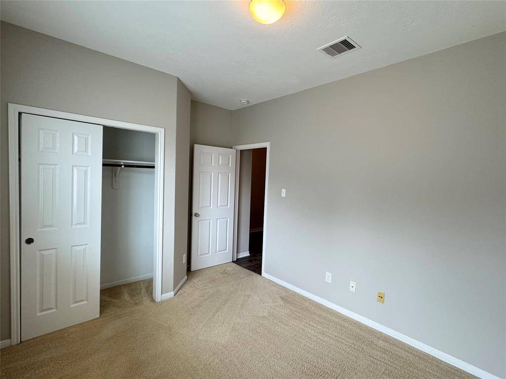 bedroom 2 (reverse view) with closet (sliding door)