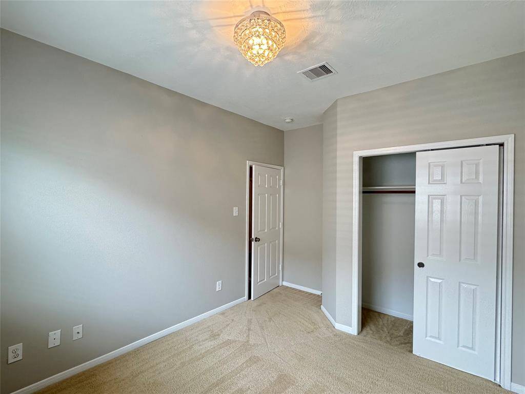 bedroom 3 (reverse view) with closet (sliding door)