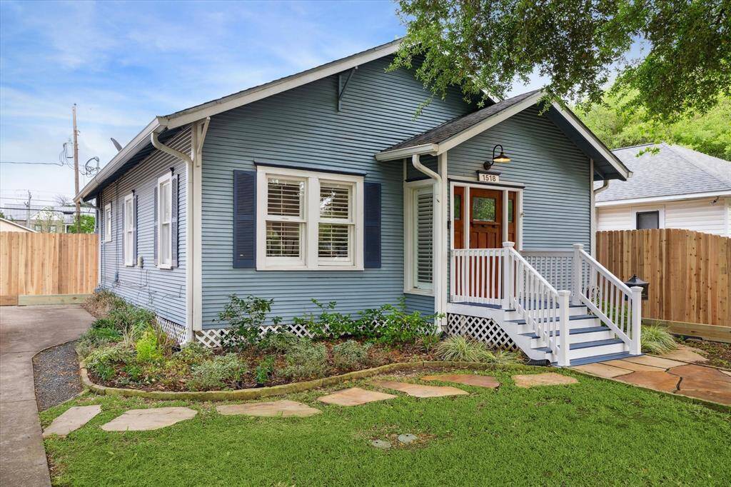 Cute bungalow exterior nestled in the middle of the street