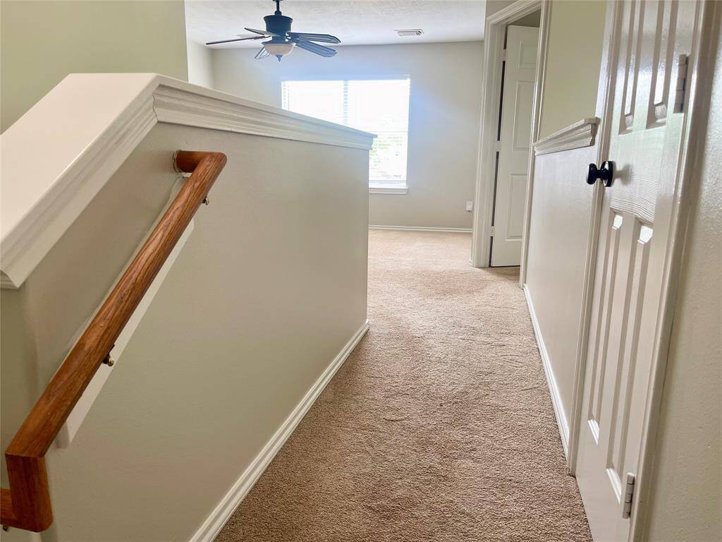 Charming fourth bedroom with elegant beadboard detailing.