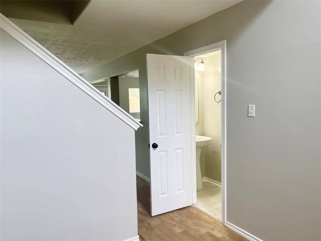 Spacious and versatile game room with plenty of natural light, perfect for entertainment and relaxation.