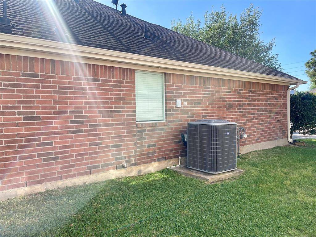Look at the mature trees, and a well-maintained lawn. It offers a private driveway leading to a spacious garage, ideal for a cozy and inviting atmosphere.