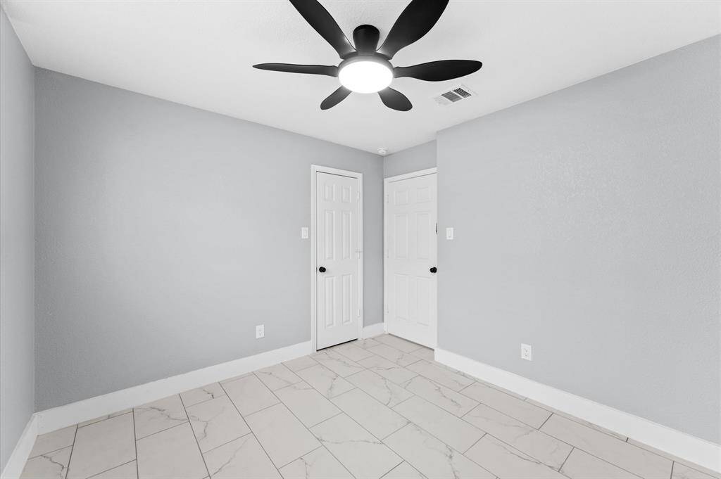 Secondary bedrooms offer ample closet space and a warm, welcoming vibe