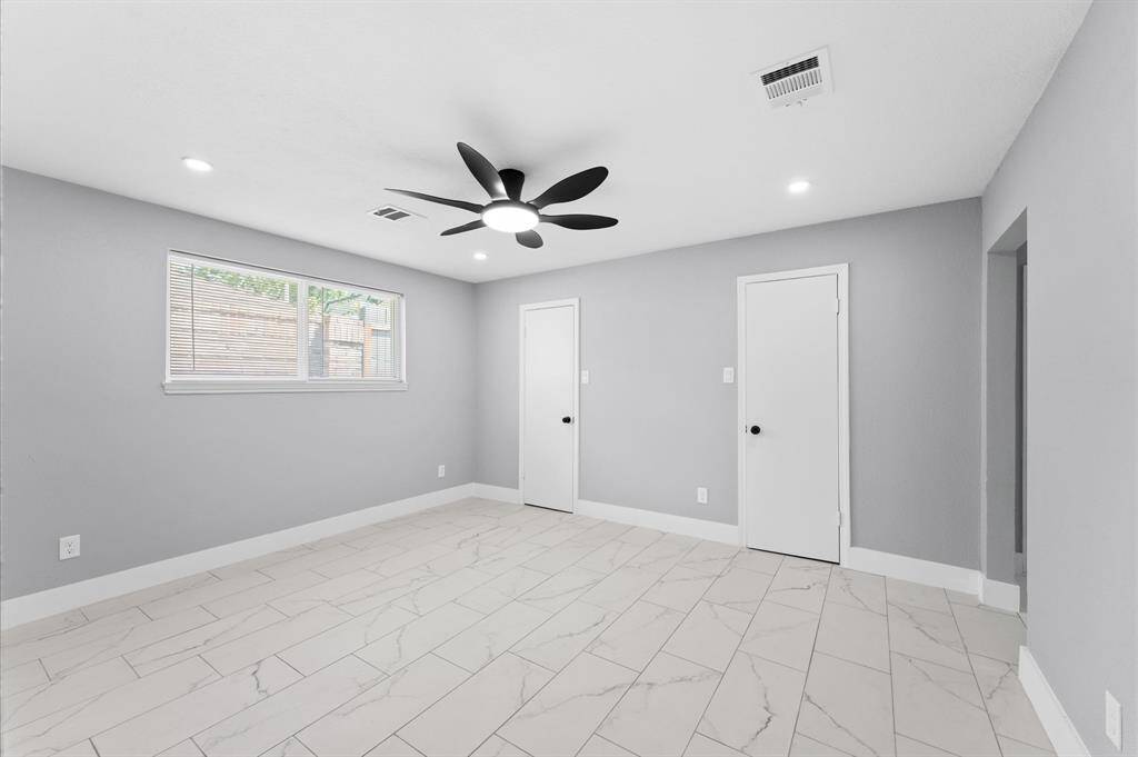 Updated primary with great natural light, featuring two walk-in closets: style and storage in one.