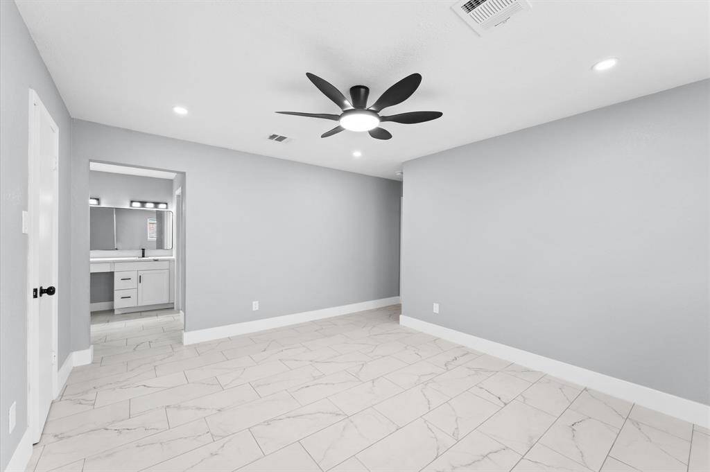 Spacious primary bedroom with large walk-in closet, loads of storage, and spacious ensuite!