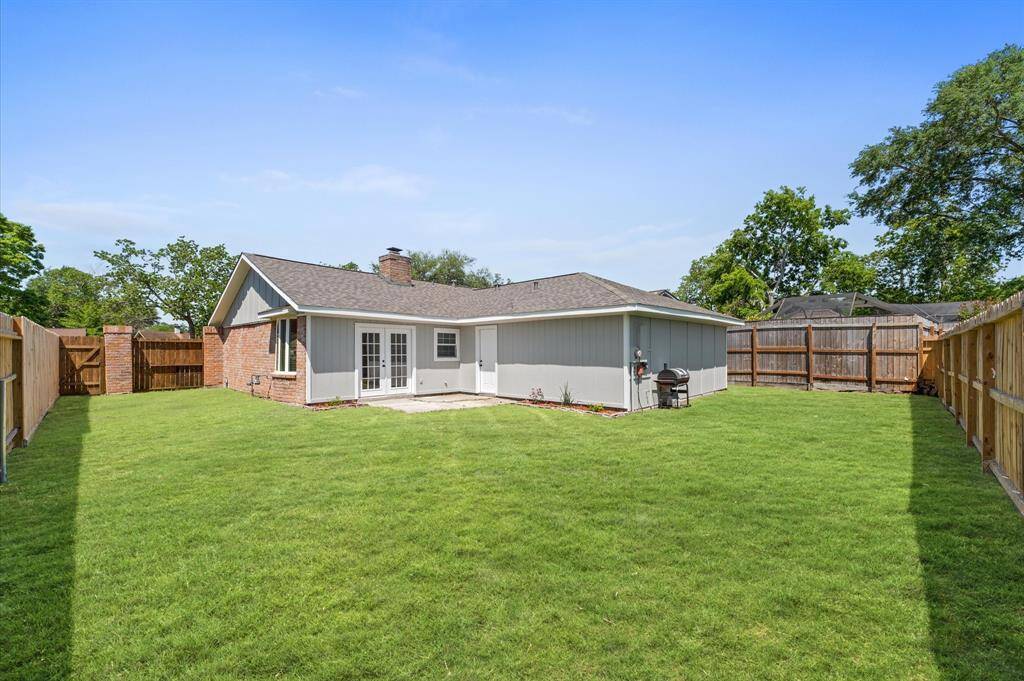 Host the ultimate backyard gathering with this expansive, fully-fenced outdoor space, complete with a portable grill and room to relax!