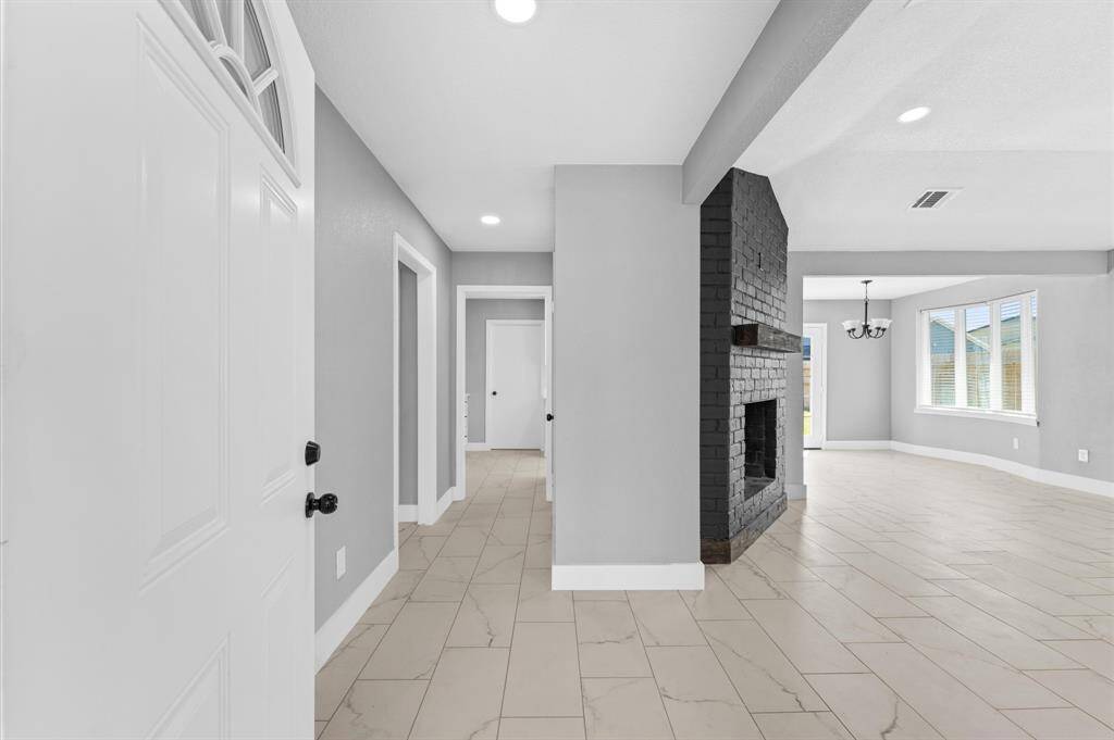 Welcoming entryway opens to a bright and spacious living room-perfect for everyday living and entertaining.