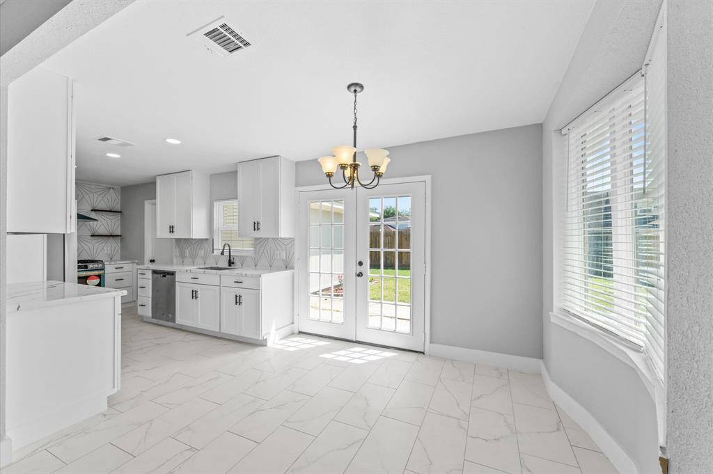 The perfect dining room-open to the kitchen and with a view to the backyard - your personal playspace