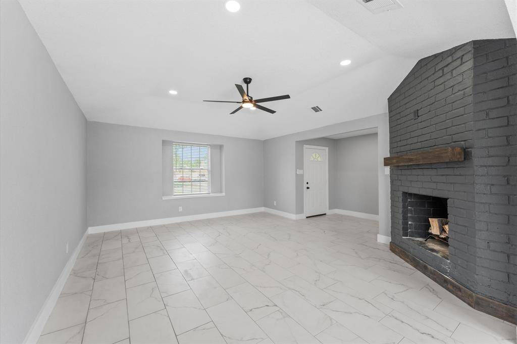 Another view of the stylish living room and entryway
