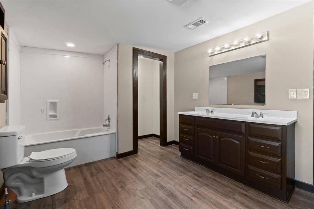 Primary bathroom with access directly to the laundry room