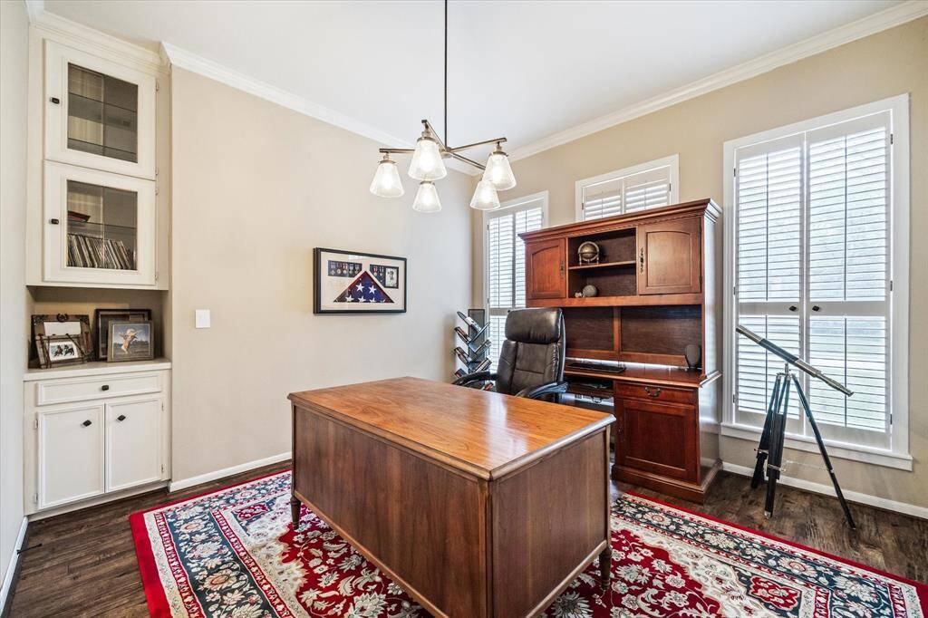 Formal dining currently being utilized as a home office.