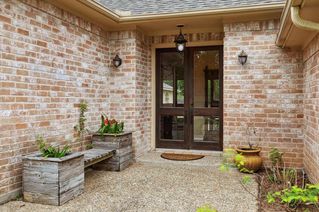 Welcoming front patio with french doors.