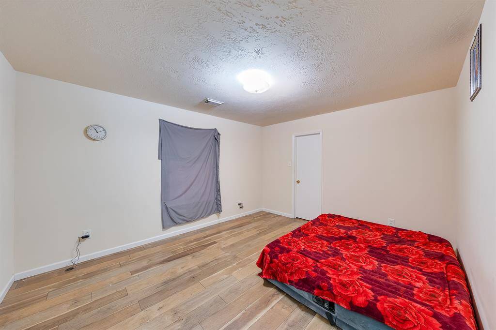 Another view of the cozy third bedroom, perfect for creating a warm and inviting space for your loved ones.