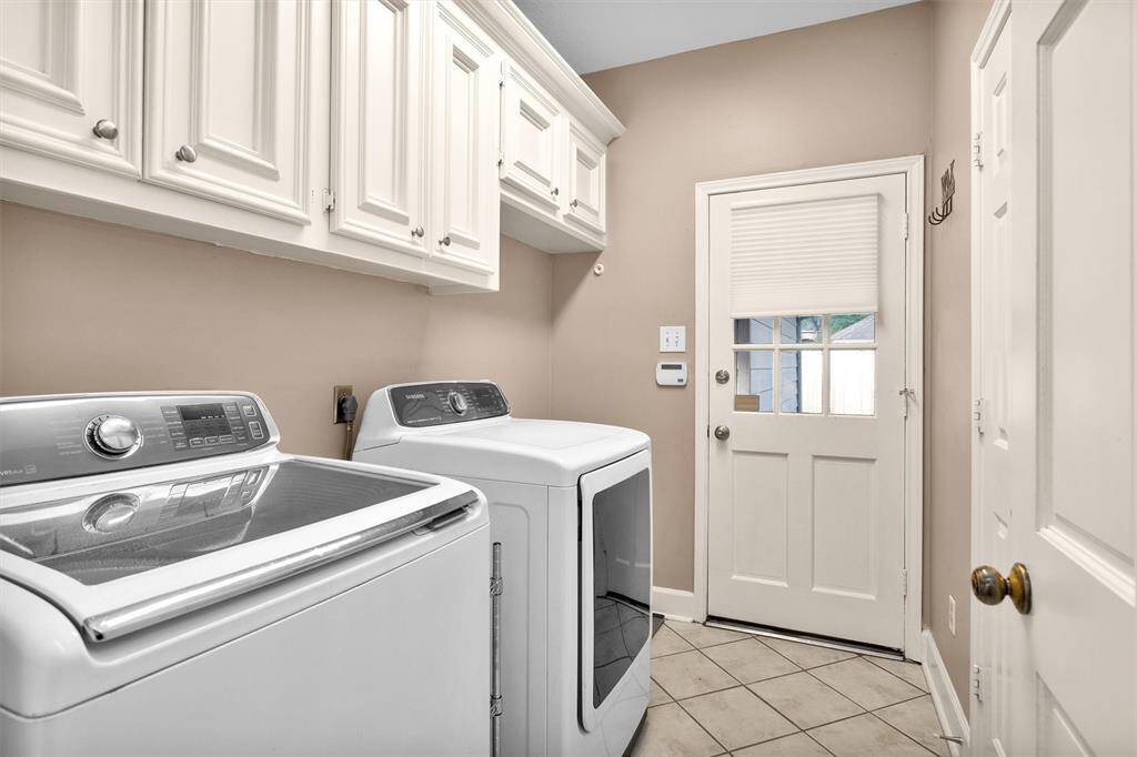 Laundry with door to back yard