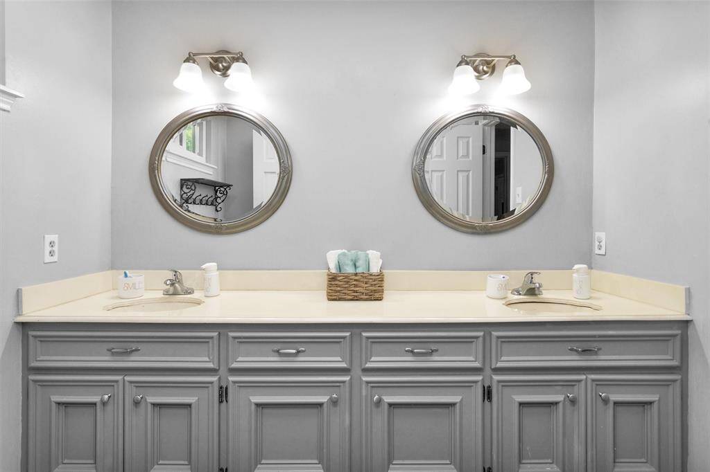 Double sinks with updated lighting and mirrors