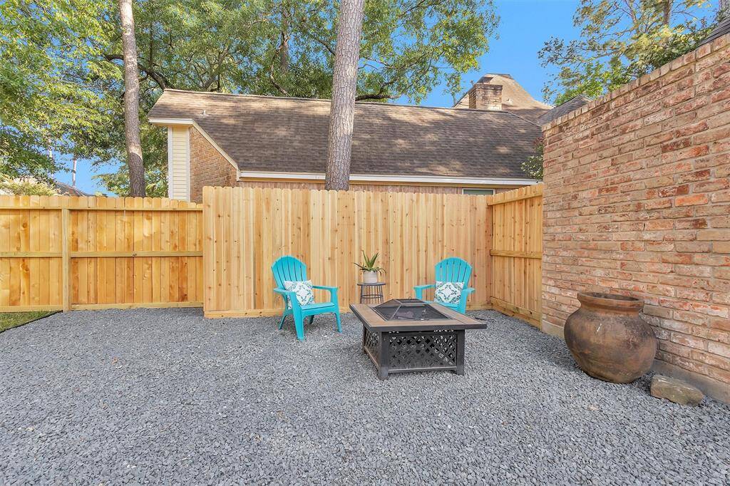 Cute fire pit area. Note the new fencing.