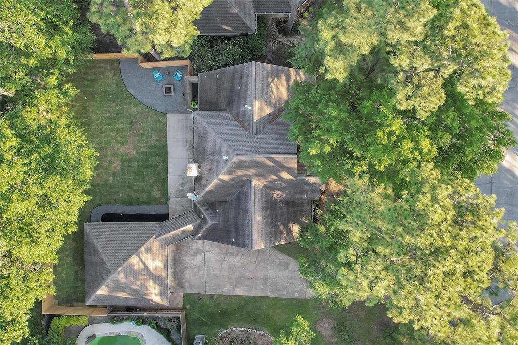 View of the home from above. Beautiful mature trees.