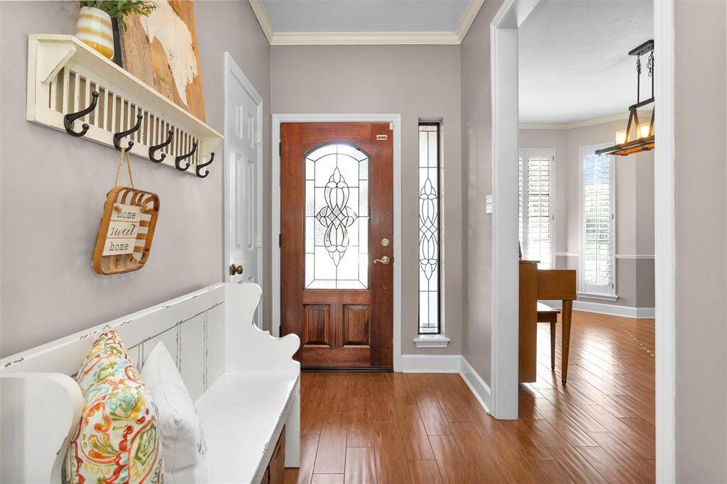 Entry hall with wood-look tile floors