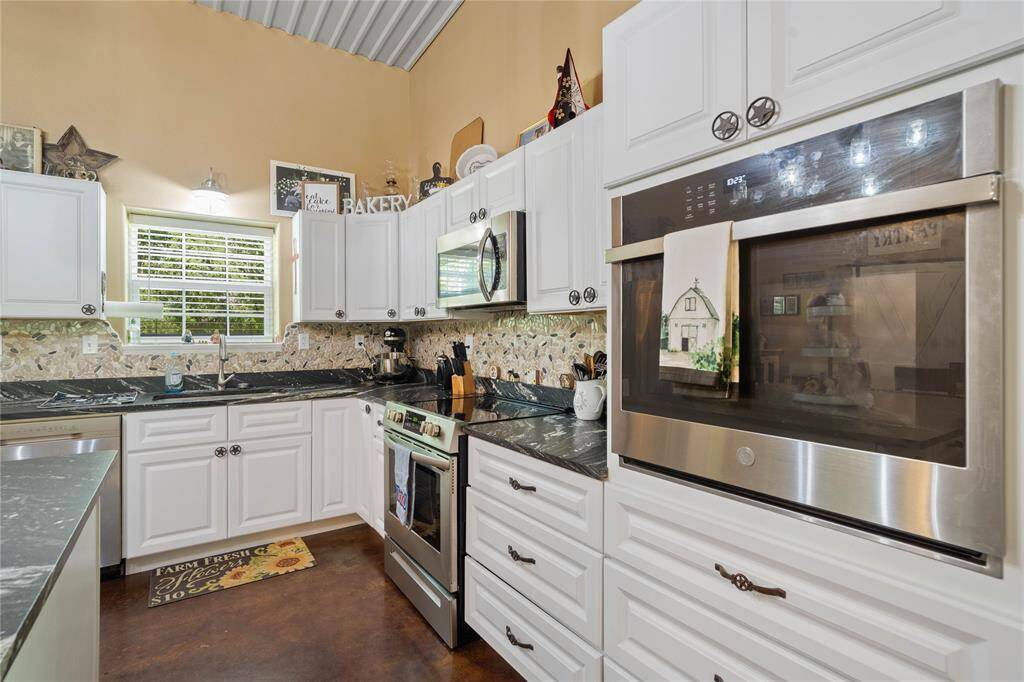 Enjoy whipping up something delicious in this kitchen and having two ovens to use.  Nice sized pots and pans doors.  All soft closing cabinets and drawers.