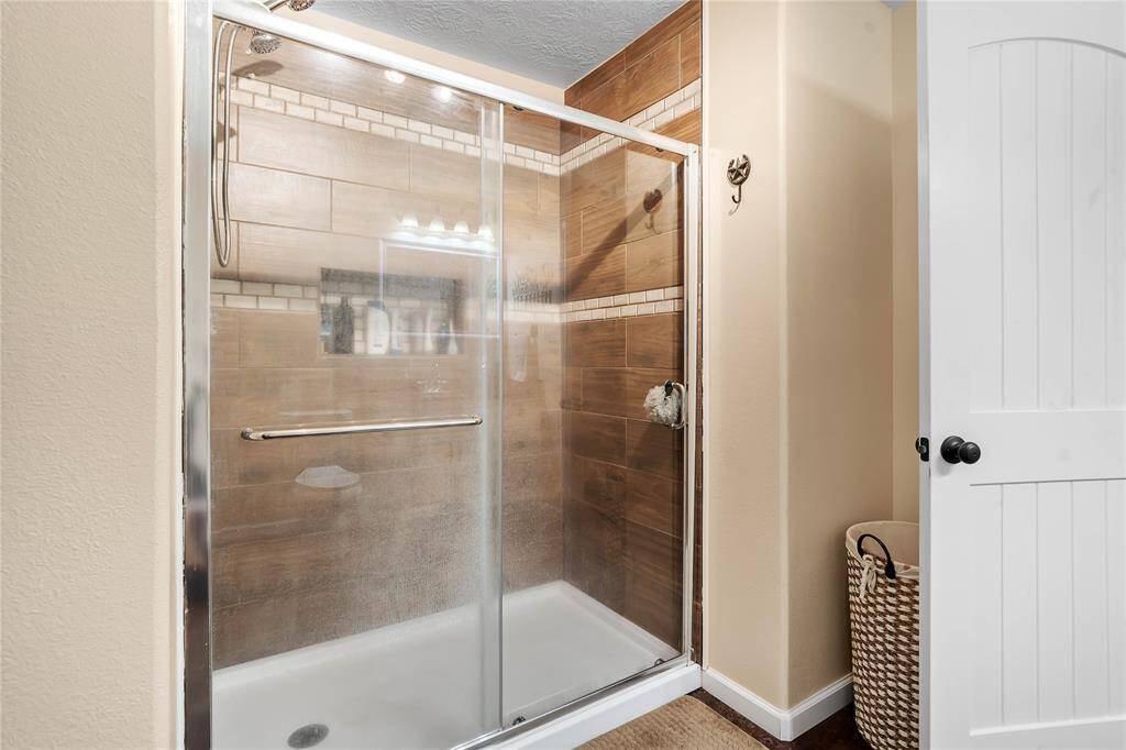 Oversized walk-in shower in the primary. Relax while your worries go down the drain.