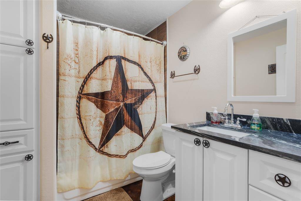 Full guest bath featuring a tub and shower combo