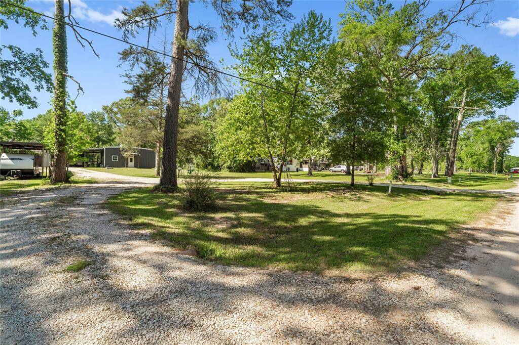 Set on a lush, 1.3 tree-lined acre with endless room to roam, this property is a rare opportunity to enjoy peaceful country living with all the convenience and flexibility on a dead-end road.