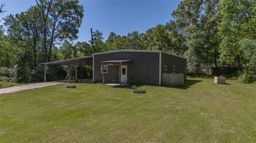 Enjoy a little slice of country heaven on 1.3 acres surrounded by tress and green grass.