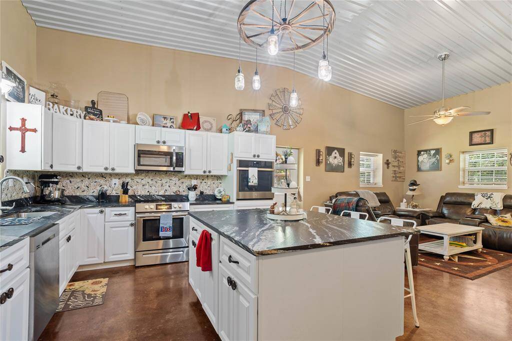 Plenty of room to prepare for family and friends celebrations and for the holidays.  Imagine the laughter and stories to be shared around this island and in the family room.  Everyone will be part of the conversation. Take notice of the two ovens.