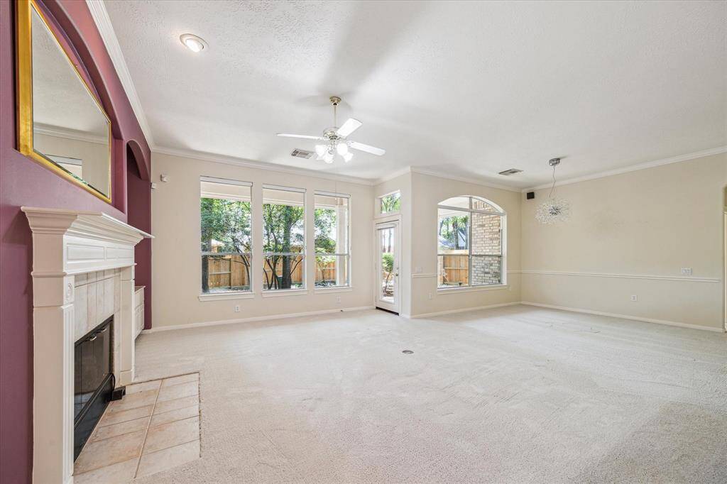 Beyond the living area, the dining room offers a seamless transition, enhancing the home's open-concept layout and making it ideal for both formal and casual entertaining. The thoughtful design ensures a cohesive flow, perfect for hosting gatherings with ease.