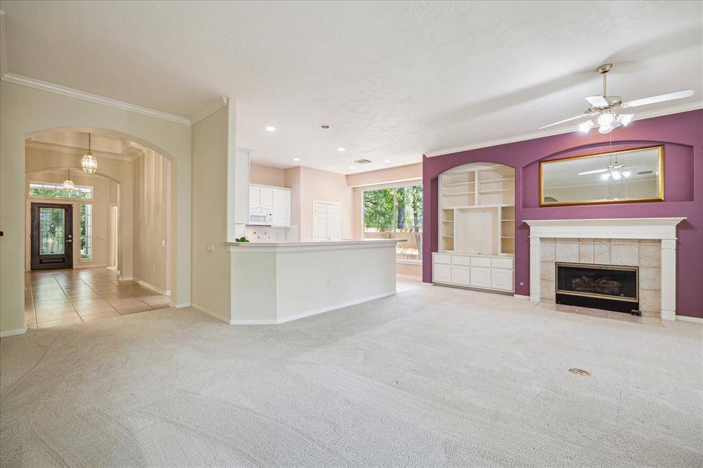 The kitchen, effortlessly open to the family room, creates a cohesive and expansive living space. With its functional layout, this area serves the heart of the home, allowing for seamless interaction and flow between cooking, dining, and relaxation. The thoughtful connection of both spaces ensures a perfect balance of convenience and simplicity.