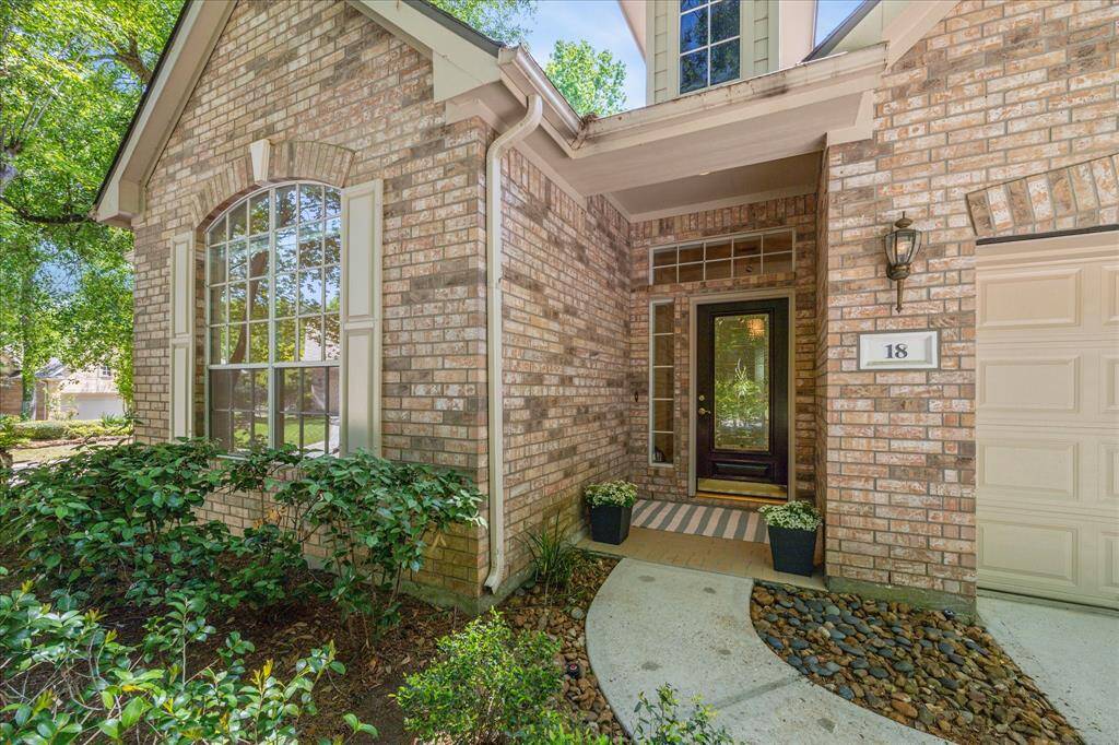 This detailed view of the charming front door showcases the home's welcoming entrance and tasteful design. Positioned on a generously sized corner lot, the property benefits from additional yard space, increased privacy, and standout curb appeal.
