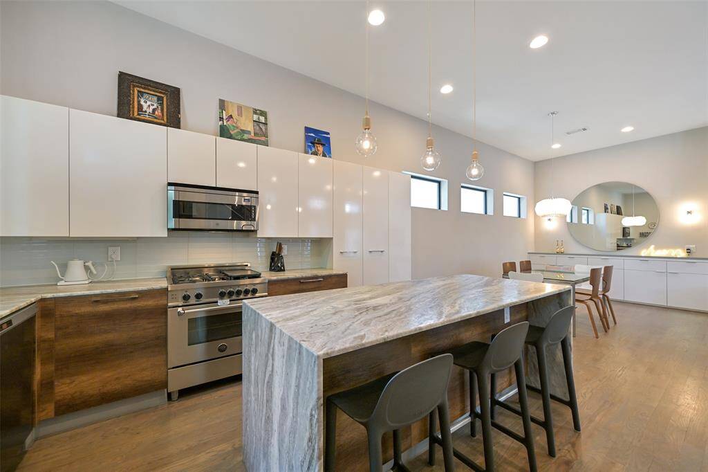Stunning open concept kitchen with beautiful waterfall island.