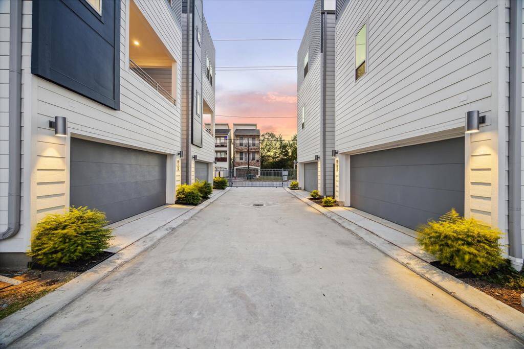 Situated in a desirable urban neighborhood, the exterior offers a blend of modern elegance and practical design, ideal for city living. Private, gated driveway with spacious garages, offering security and modern comfort.