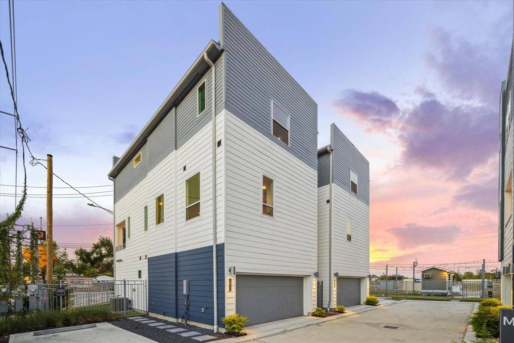 Situated in a desirable urban neighborhood, the exterior offers a blend of modern elegance and practical design, ideal for city living. Private, gated driveway with spacious garages, offering security and modern comfort.