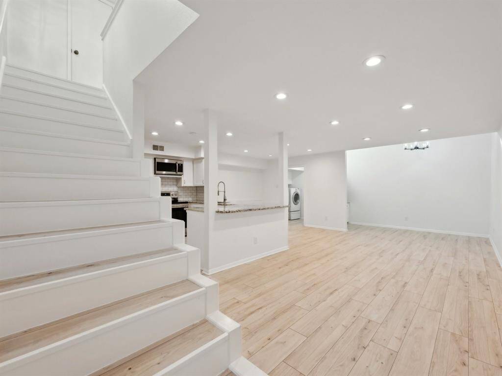 The living and dining area is open to the kitchen. So sleek and modern!