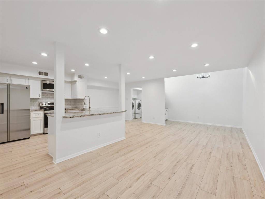 Breakfast bar seating adorns the Kitchen.