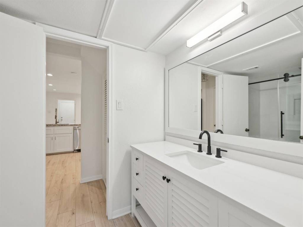 The downstairs bathroom has new counters and cabinetry.