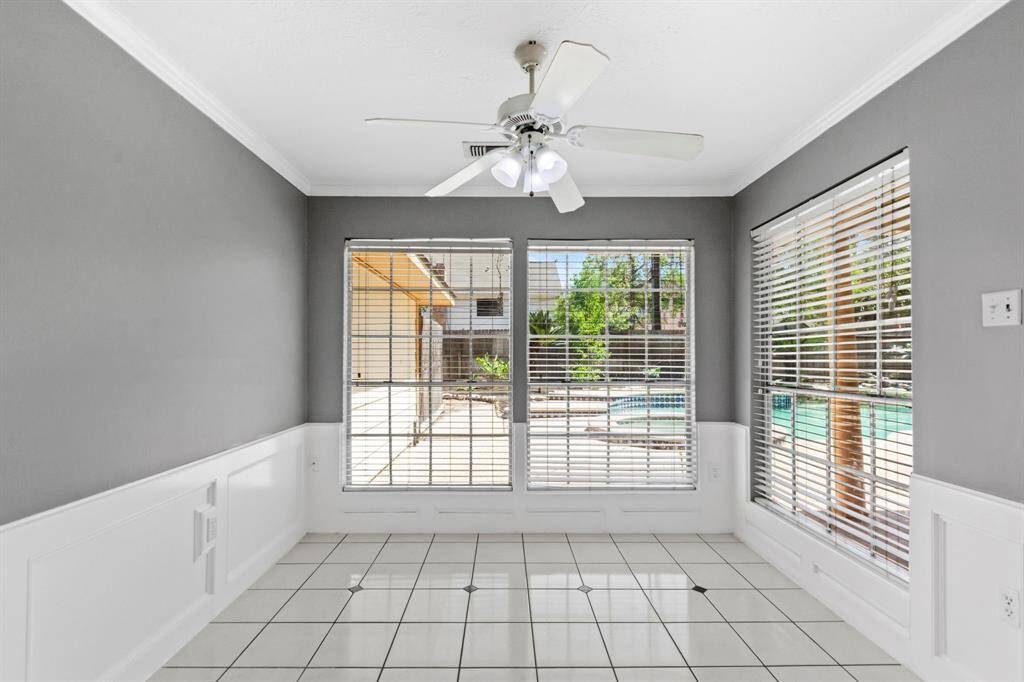 Bright and airy breakfast room with large windows overlooking the pool!