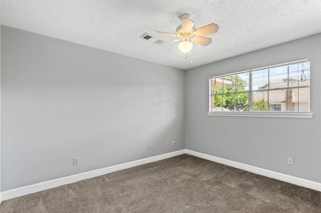 Spacious fifth bedroom with neutral paints!
