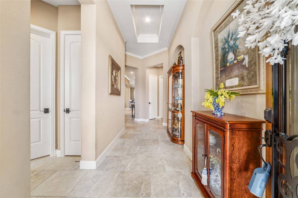 Entrance with gorgeous tile, high tray ceilings!