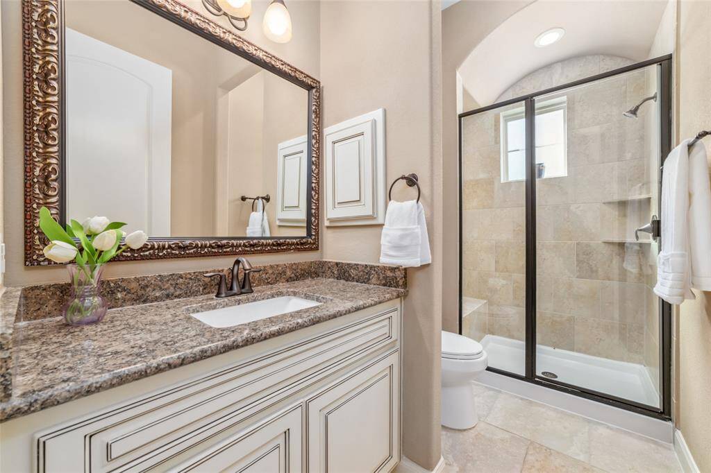 Secondary bedroom with Granite counters and walk in shower