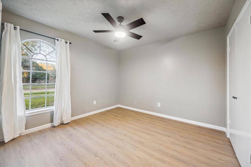 Secondary bedroom at front of house to the right.