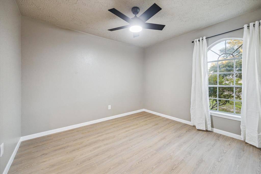 Secondary bedroom at front of house to the left.